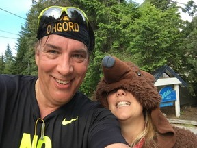 After surviving the uphill torture test that was Blueberry Hill, 10K blogger Gord Kurenoff stopped for a hug and a selfie from a volunteer dressed in a bear suit during Saturday's North Face Whistler Half Marathon.