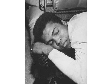 Boxer Muhammad Ali takes a nap on the bus from Seattle to Vancouver before his exhibition bout at the Coliseum in 1972.