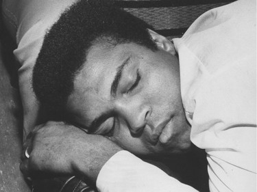 Boxer Muhammad Ali takes a nap on the bus from Seattle to Vancouver before his exhibition bout at the Coliseum in 1972.