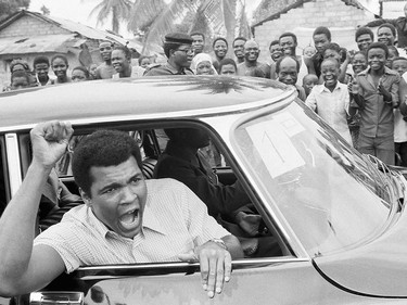 FILE - This is a Sept. 17, 1974  file photo of Muhammad Ali as he chants to fans during  a sightseeing tour downtown Kinshasa, Zaire.  It was 40 years ago that two men met just before dawn on Oct. 30, 1974, to earn $5 million in the Rumble in the Jungle. In one of boxing's most memorable moments, Muhammad Ali stopped the fearsome George Foreman to recapture the heavyweight title in the impoverished African nation of Zaire. (AP Photo, File) ORG XMIT: POS2014103012382835      Muhammad Ali options ORG XMIT: POS1606031709170308