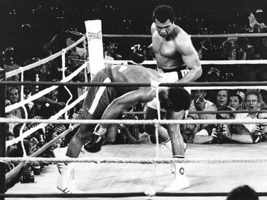 FILE - This is a Oct. 30, 1974  file photo of Muhammad Ali as he watches George Foreman head for the canvas after being knocked out in the eighth round of their match in Kinshasa, Zaire. It was 40 years ago that two men met just before dawn on Oct. 30, 1974, to earn $5 million in the Rumble in the Jungle. In one of boxing's most memorable moments, Muhammad Ali stopped the fearsome George Foreman to recapture the heavyweight title in the impoverished African nation of Zaire. (AP Photo, File) ORG XMIT: POS2014103012390838      Muhammad Ali options ORG XMIT: POS1606031709160307