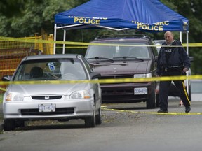 Burnaby, BC: JUNE 14, 2016 --   Police investigate a shooting death in the 3900-block Forest Street in Burnaby, BC early Tuesday morning June 14, 2016. The shooting occurred late Monday evening.