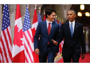 Prime Minister of Canada Justin Trudeau (L) and US President Barack Obama exit the Hall of Honour on Parliament Hill following the North American Leaders Summit in Ottawa, June 28, 2016.   /