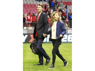 VANCOUVER, BC - JUNE 11:  Vancouver mayor Gregor Robertson and his rock star girlfriend Wanting Qu leave the Men's International Rugby match between Canada and Japan at BC Place on June 11, 2016 in Vancouver, Canada.  Japan won 26-22.