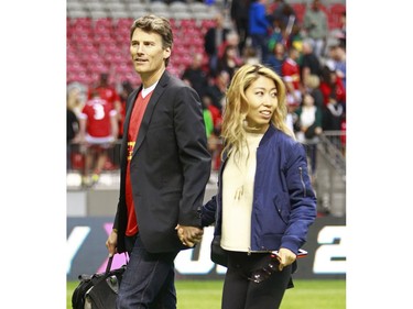 VANCOUVER, BC - JUNE 11:  Vancouver mayor Gregor Robertson and his rock star girlfriend Wanting Qu leave the Men's International Rugby match between Canada and Japan at BC Place on June 11, 2016 in Vancouver, Canada.  Japan won 26-22.