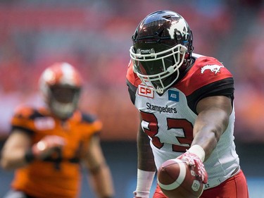 Calgary Stampeders' Jerome Messam scores a touchdown against the B.C. Lions during the first half of a pre-season CFL football game in Vancouver, B.C., on Friday June 17, 2016. THE CANADIAN PRESS/Darryl Dyck ORG XMIT: VCRD112