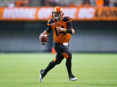 B.C. Lions quarterback Travis Lulay runs with the ball as he looks for an open receiver during the second half of a pre-season CFL football game against the Calgary Stampeders in Vancouver, B.C., on Friday June 17, 2016. THE CANADIAN PRESS/Darryl Dyck ORG XMIT: VCRD129