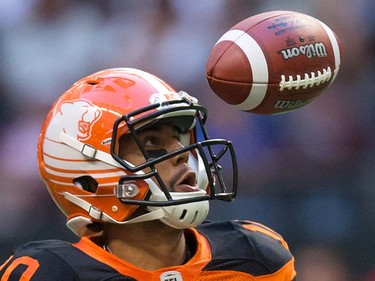 B.C. Lions quarterback Jonathon Jennings watches the ball after bobbling a snap during the first half of a pre-season CFL football game against the Calgary Stampeders in Vancouver, B.C., on Friday June 17, 2016. THE CANADIAN PRESS/Darryl Dyck ORG XMIT: VCRD101