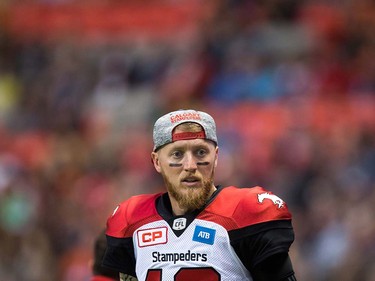 Calgary Stampeders' quarterback Bo Levi Mitchell stands on the bench during the second half of a pre-season CFL football game against the B.C. Lions in Vancouver, B.C., on Friday June 17, 2016. THE CANADIAN PRESS/Darryl Dyck ORG XMIT: VCRD127