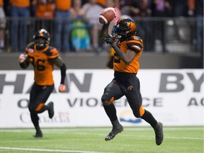 B.C. Lions' Chris Rainey returns a Calgary Stampeders punt 72 yards for a touchdown and the deciding points during the second half Saturday's game at B.C. Place.