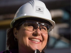 British Columbia Premier Christy Clark smiles during a tour before a groundbreaking event for FortisBC's Tilbury LNG facility expansion project in Delta, B.C., on Tuesday October 21, 2014. In Clark's vision of British Columbia's economic future, natural gas is the headliner as the province gears up to export billions of tonnes of liquefied natural gas from proposed projects.