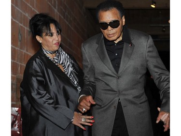 CORRECTION  -- WOMAN IDENTIFIED***Vancouver B.C.--10/08/09-Boxing legend Muhammad Ali arrives, with MARILYN WILLIAMS, sister of his wife Lonnie Ali, at District 319 in downtown Vancouver Thursday October 8, 2009 for the screening of a VIFF movie about his life Facing Ali. (Jenelle Schneider/Vancouver Sun) (for story by Yvonne Zacharias) [PNG Merlin Archive]