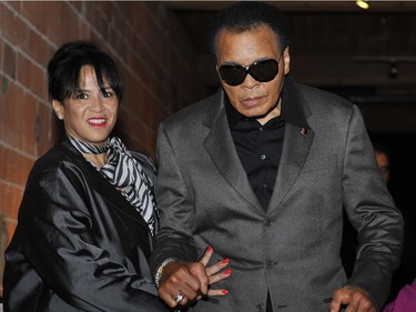 CORRECTION  -- WOMAN IDENTIFIED*** Vancouver B.C.--10/08/09-Boxing legend Muhammad Ali arrives with MARILYN WILLIAMS, sister of his wife Lonnie Ali, at District 319 in downtown Vancouver Thursday October 8, 2009 for the screening of a VIFF movie about his life Facing Ali. (Jenelle Schneider/Vancouver Sun) (for story by Yvonne Zacharias) [PNG Merlin Archive]