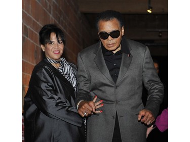 CORRECTION  -- WOMAN IDENTIFIED*** Vancouver B.C.--10/08/09-Boxing legend Muhammad Ali arrives with MARILYN WILLIAMS, sister of his wife Lonnie Ali, at District 319 in downtown Vancouver Thursday October 8, 2009 for the screening of a VIFF movie about his life Facing Ali. (Jenelle Schneider/Vancouver Sun) (for story by Yvonne Zacharias) [PNG Merlin Archive]