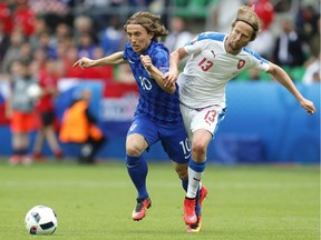Croatia's Luka Modric, left, and the Czech Republic's Jaroslav Plasil vie for the ball during a Euro 2016 Group D match at the Geoffroy Guichard stadium in Saint-Etienne, France, on June 17. — The Associated Press