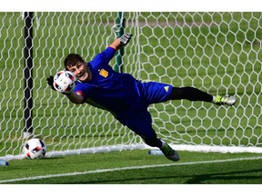 Spain goalkeeper Iker Casillas makes a stop during a training session. Italy's reward for winning its group is a match Monday against two-time defending champion Spain.