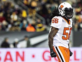 B.C. Lions linebacker Solomon Elimimian celebrates his sack on Hamilton Tiger-Cats quarterback Zach Collaros during the first half of their CFL game in Hamilton, Ont., Saturday, October 4, 2014.The league's most outstanding player in 2014, the B.C. Lions linebacker ruptured his Achilles tendon last August and was lost for the season. THE CANADIAN PRESS/Aaron Lynett ORG XMIT: CPT108