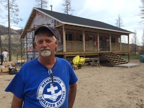 Gerald Dyck, chair of the Mennonite Disaster Service in B.C., outside the house his group is building for Dale and JD Winn in Westbridge. The Winns lost their home in the Rock Creek fire last year and are rebuilding with the help of MDS and a zero-interest mortgage from Habitat for Humanities Southeast BC.