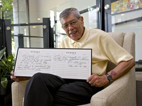 Jack Lee, onetime head of public relations for the PNE, shows the guest book in which heavyweight boxing icon Muhammad Ali wrote three short poems while on a visit to Vancouver in January 1972.