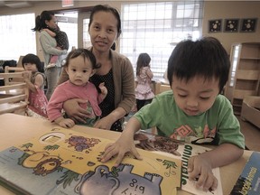 Muyu Newson with Bethany and Jacob at the family literacy program at Langley Community Services Society.