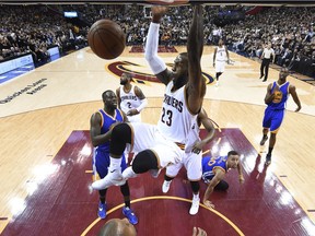 Cleveland Cavaliers forward LeBron James (23) dunks against the Golden State Warriors during Game 6 of basketball's NBA Finals in Cleveland, Friday, June 17, 2016. Cleveland won 115-101. (Bob Donnan/Pool Photo via AP) ORG XMIT: OHPS164