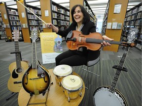 Vancouver Public Library's Sandra Singh with the musical instruments that are now available as part of the library's new musical lending program.