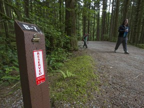 Campers by a reserved campsite at Golden Ears Provincial Park.