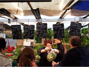 Marché de la Bastille is one of the largest markets held in Paris on Sunday mornings where tourists and locals surround the stalls for a taste.