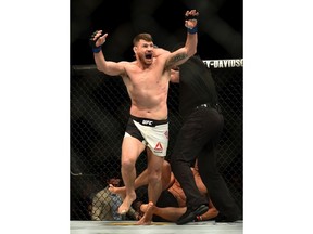 Michael Bisping reacts after knocking out Luke Rockhold during UFC 199 in Inglewood, Calif., Saturday.