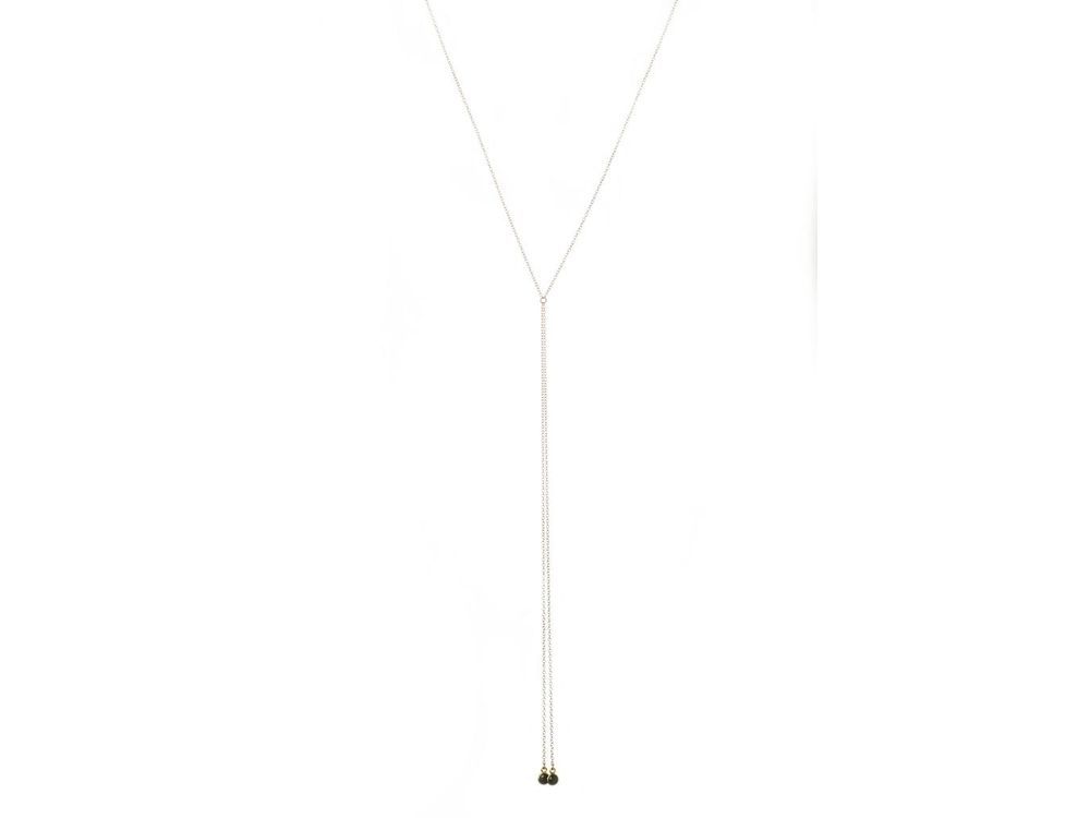 Morrison necklace from the Vancouver-based line Lisbeth is a gold-fill lariat with tiny black onyx stones. 