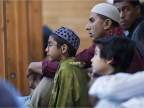 BURNABY,BC:JULY 28, 2014 -- A young boy waits for the start of the Eid Ul Fitr prayer service at the Masjid al-Salaam and Education Centre to mark the end of Ramadan in Burnaby, BC, July, 28, 2014. (Richard Lam/PNG) (For Bethany Lindsay) [PNG Merlin Archive]