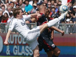 Former Whitecap Terry Dunfield kicks the ball beside Joel Lindpere of the New York Red Bulls during their match on May 28, 2011, in Vancouver. Dunfield is thankful that after his playing days he's caught on with soccer broadcasting. — Getty Images files