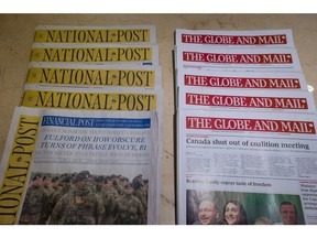 A major new report is calling for drastic changes to help shore up Canada's news industry as it faces a massive decline in revenues and a growing "fake news" problem. Copies of Canada's national newspapers, the National Post and The Globe and Mail are displayed at a hotel in Burnaby, on Tuesday January 19, 2016.