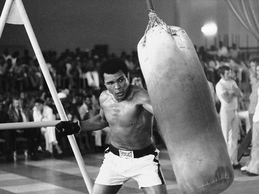 FILE - In this October 1974 file photo taken by Associated Press photographer, Muhammad Ali works out before his bout against George Foreman in Zaire. Faas, a prize-winning combat photographer who carved out new standards for covering war with a camera and became one of the world's legendary photojournalists in nearly half a century with The Associated Press, died Thursday May 10, 2012. He was 79. (AP Photo/Horst Faas, File) ORG XMIT: POS2016060317080454      Muhammad Ali options ORG XMIT: POS1606031709250322