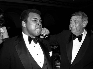FILE - In this April 13, 1981, file photo, sportscaster Howard Cosell, right, is pictured laying one on the chin of former world heavyweight boxing champ Muhammad Ali during a dinner in New York. Ali, the magnificent heavyweight champion whose fast fists and irrepressible personality transcended sports and captivated the world, has died according to a statement released by his family Friday, June 3, 2016. He was 74. (AP Photo/Richard Drew, File) ORG XMIT: NY219