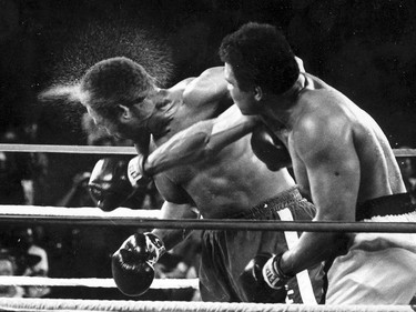 FILE - This is a Oct. 30, 1974,  file photo showing George Foreman taking a right to the head from challenger Muhammad Ali in the seventh round in the match dubbed Rumble in the Jungle in Kinshasa, Zaire. Ali, the magnificent heavyweight champion whose fast fists and irrepressible personality transcended sports and captivated the world, has died according to a statement released by his family Friday, June 3, 2016. He was 74. (AP Photo/Ed Kolenovsky, File) ORG XMIT: NY204