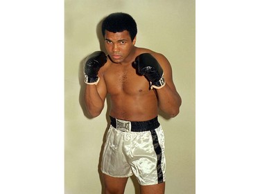 FILE - This is an Oct. 9, 1974, file photo showing Muhammad Ali.  Ali, the magnificent heavyweight champion whose fast fists and irrepressible personality transcended sports and captivated the world, has died according to a statement released by his family Friday, June 3, 2016. He was 74. (AP Photo/Ross D. Franklin, File)(AP Photo/FIle) ORG XMIT: NY202