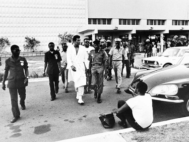 In this photo taken on October 19, 1974 shows US boxing heavyweight champion Muhammad Ali (C) (born Cassius Clay) is escoted at his training center 11 days before the heavyweight world championship in Kinshasa. On October 30, 1974 Muhammad Ali knocked out George Foreman in a clash of titans known as the "Rumble in the Jungle", watched by 60 000 people in the stadium in Kinshasa and millions elsewhere. AFP PHOTO        (Photo credit should read STR/AFP/Getty Images) ORG XMIT: BOX12      Muhammad Ali options ORG XMIT: POS1606031703340280