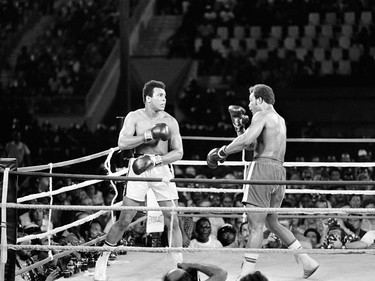 In this photo taken on October 30, 1974 shows the fight between US boxing heavyweight champions, Muhammad Ali (L) (born Cassius Clay) and George Foreman in Kinshasa. On October 30, 1974 Muhammad Ali knocked out George Foreman in a clash of titans known as the "Rumble in the Jungle", watched by 60 000 people in the stadium in Kinshasa and millions elsewhere. AFP PHOTO        (Photo credit should read STR/AFP/Getty Images) ORG XMIT: BOX05      Muhammad Ali options ORG XMIT: POS1606031703330279