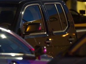 Bullet holes can be seen on the driver side door of a Nissan truck after a man was shot at Coppersmith Plaza in Richmond on June, 4, 2016.
