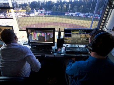 VANCOUVER,BC:JUNE 20, 2016 -- The production crew works in the press box above Nat Bailey Stadium during Northwest League baseball action between the Vancouver Canadians and the Everett AquaSox in Vancouver, BC, June, 20, 2016.