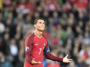Portugal's Cristiano Ronaldo gestures during the Euro 2016 Group F soccer match between Portugal and Austria at the Parc des Princes stadium in Paris, France, Saturday, June 18, 2016.