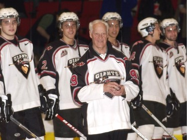 Gordie Howe stands in front of the Vancouver Giants in 2003 before they faced off against Seattle Thunderbirds in a game where about 4,000 were sold at the Pacific Coliseum.