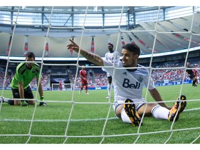 Vancouver Whitecaps midfielder Cristian Techera sits in the net behind Ottawa Fury goalkeeper Romuald Peiser after failing to connect with a pass June 8. The Bug set a target of 15 goals for himself at the start of the season but has yet to score.