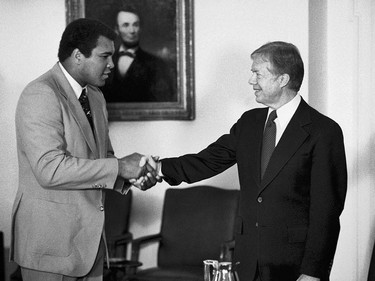 ADVANCE FOR USE SUNDAY, FEB. 23, 2014 AND THEREAFTER - FILE - In this Monday, Feb. 11, 1980 file photo, retired heavyweight boxer Muhammad Ali, left, shakes hands with President Jimmy Carter in the Cabinet Room at the White House in Washington before talking to the president about his recent trip to Africa. (AP Photo/Jim Wilson) ORG XMIT: NY357