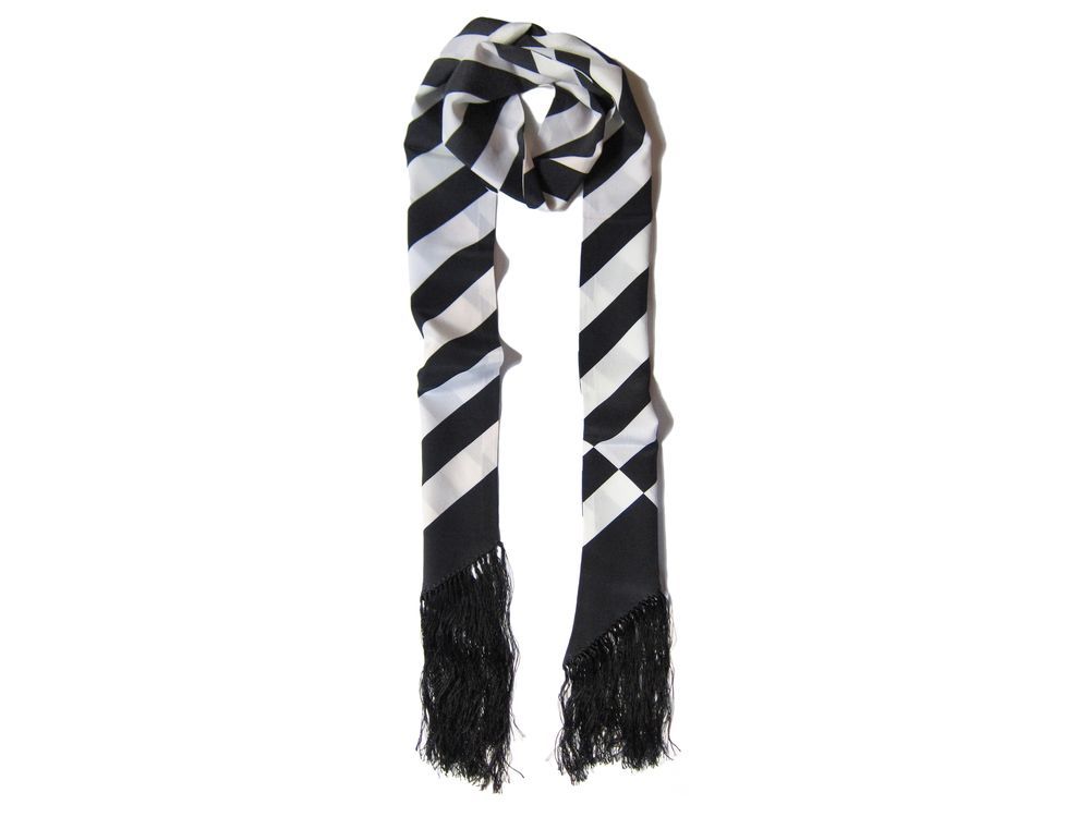 Striped skinny scarf crafted from 100 per cent silk with hand-sewn fringe. $145 | Monasultan.com 