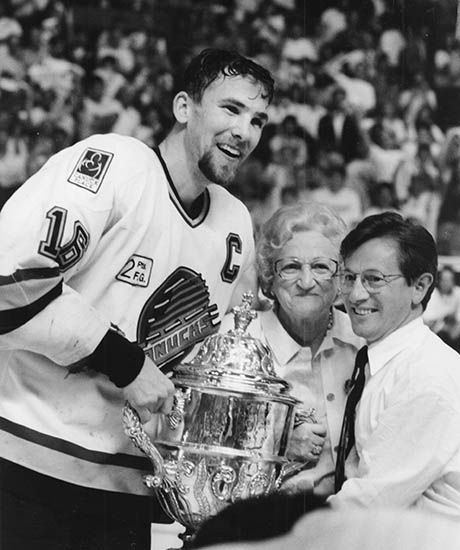 Trevor Linden poses for a photo with Emily and Arthur Griffiths after the Canucks won the Western Conference at the Pacific Coliseum on May 24, 1994.
