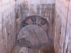 Boring machine breaks out at end of Evergreen Line tunnel.