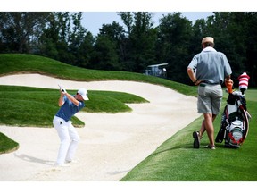 OAKMONT, PA - JUNE 15:  Matt Fitzpatrick of England plays a shot from a bunker as his caddie looks on during a practice round prior to the U.S. Open at Oakmont Country Club on June 15, 2016 in Oakmont, Pennsylvania.