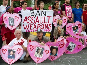 Activists protest at the entrance of the National Rifle Association in Fairfax, Virginia, calling for a ban on assault weapons.